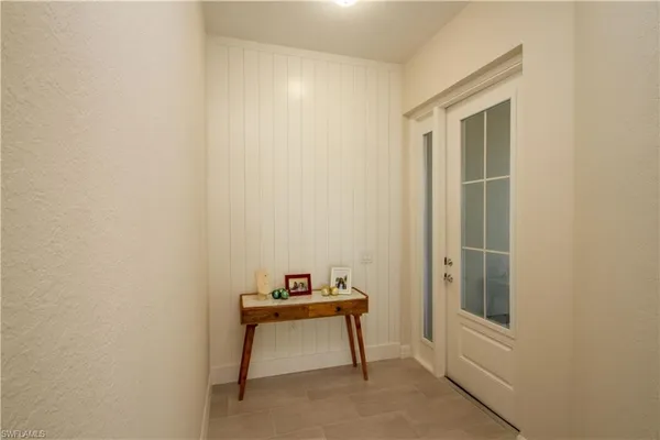 a room that has a bed and a table in it