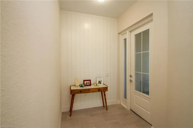 a room that has a bed and a table in it