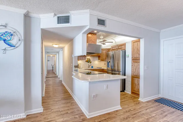a kitchen with granite countertop a sink and a stove