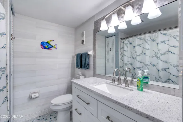 a bedroom with two beds and a window