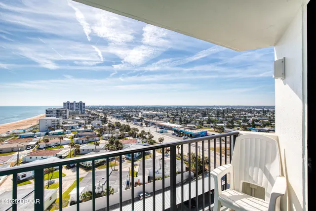 a swimming pool with outdoor seating and yard