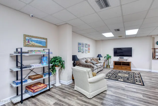 a kitchen with refrigerator and cabinets