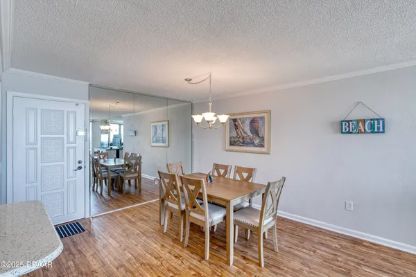a kitchen with stainless steel appliances granite countertop a sink a stove and a microwave