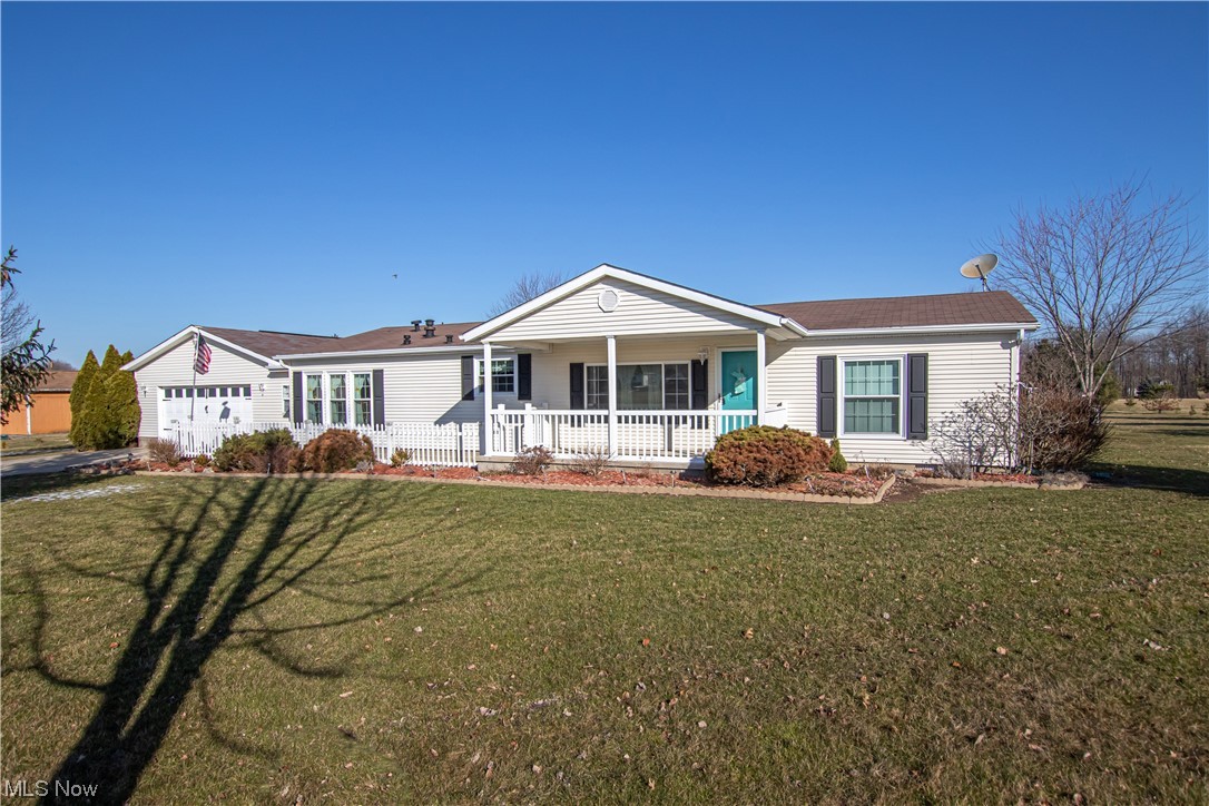 9459 Stone Road Litchfield, OH 44253 - Photo 41 of 50 Ranch-style home with a front lawn and covered porch