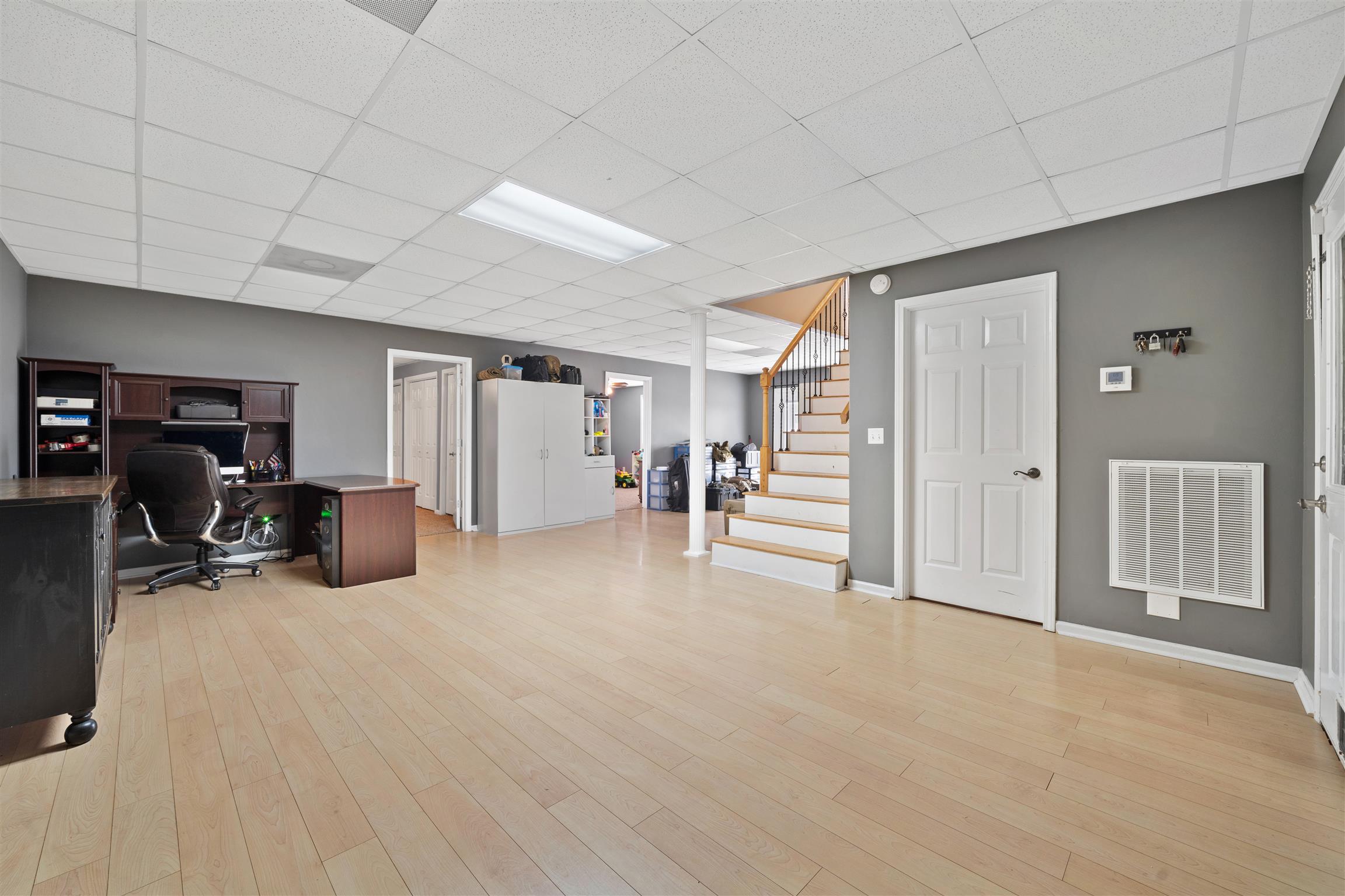 6977 Woodruff Tolleson Road Adams, TN 37010 - Photo 17 of 27 a view of a livingroom with furniture and a gym equipment