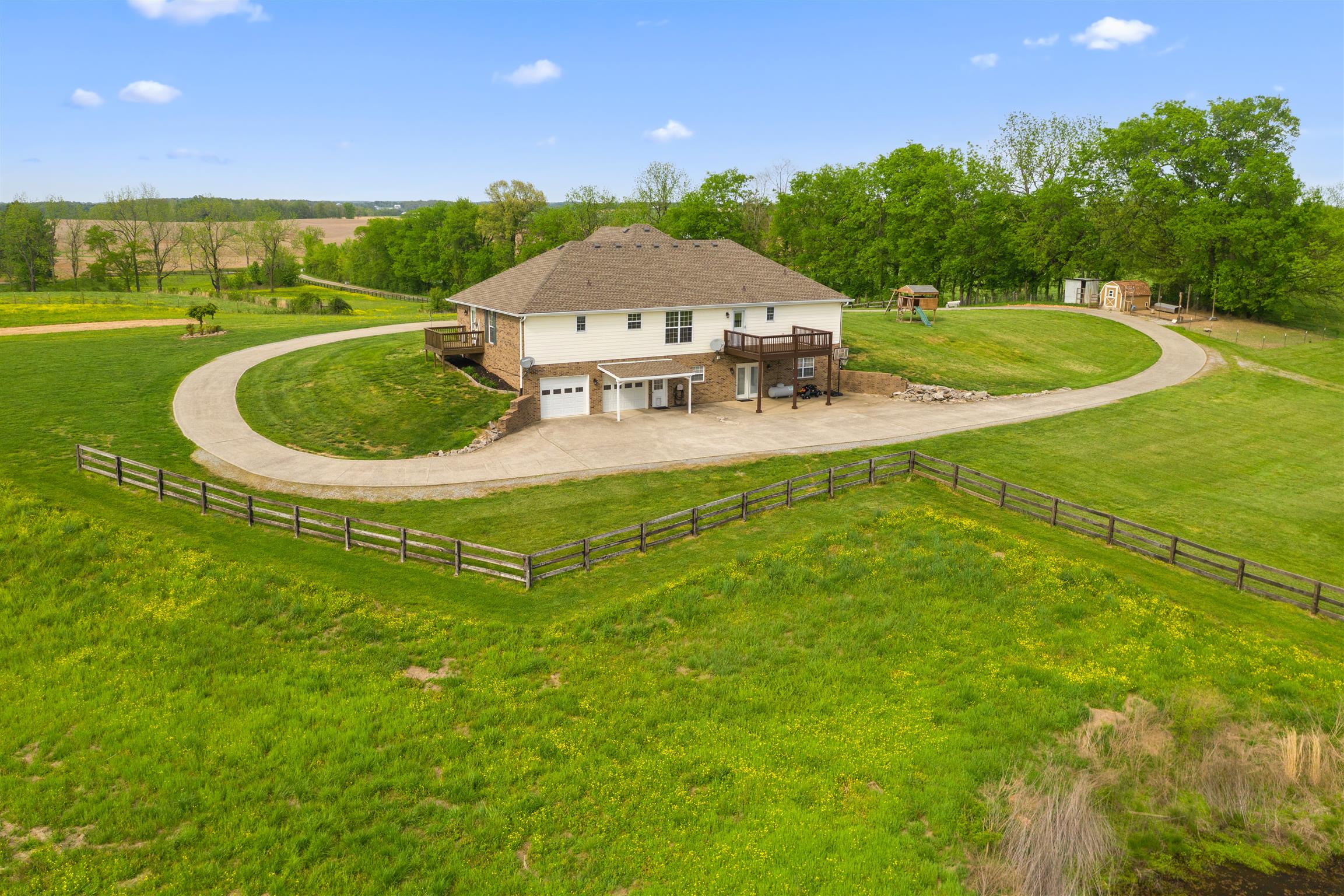 6977 Woodruff Tolleson Road Adams, TN 37010 - Photo 2 of 27 a view of a swimming pool with a yard