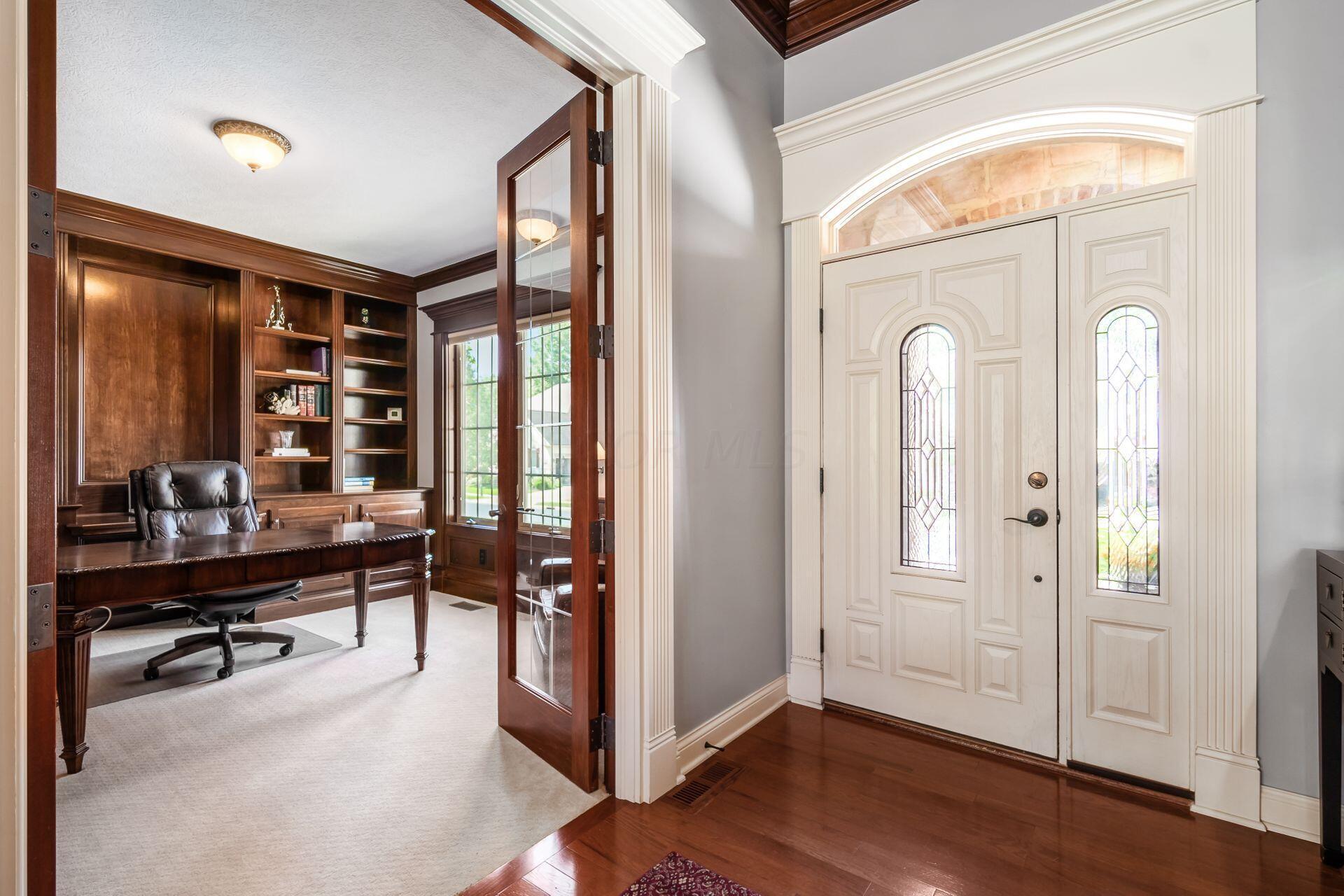 5475 Slater Ridge Westerville, OH 43082 - Photo 16 of 51 From the den, you can see through the open doorway to the entry, where a welcoming atmosphere is created by a well-appointed space and inviting decor.