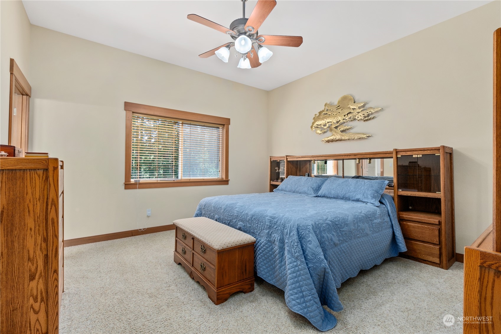 6605 Stringtown Road East Eatonville, WA 98328 - Photo 14 of 40 a bedroom with a bed and a chandelier