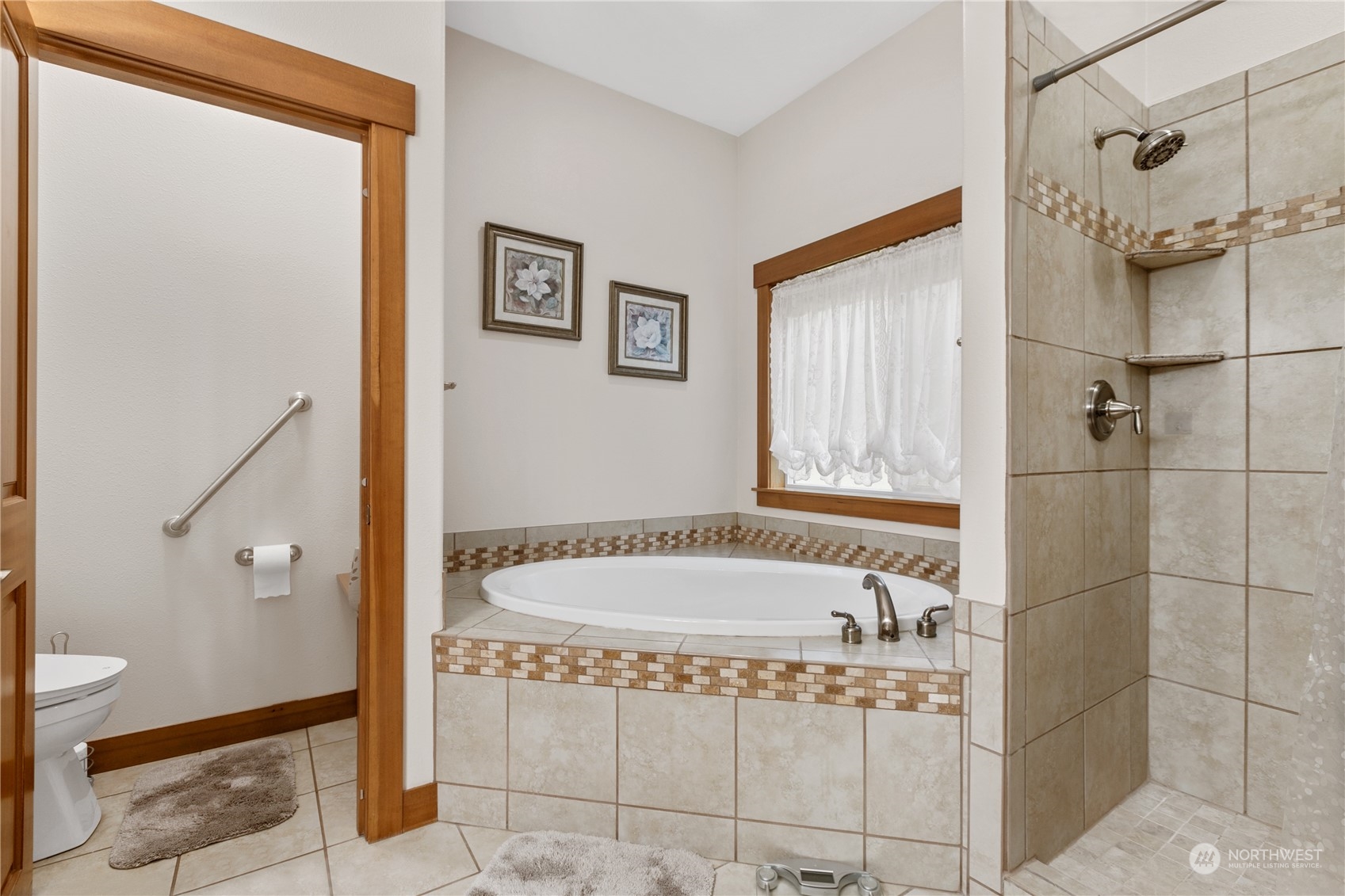6605 Stringtown Road East Eatonville, WA 98328 - Photo 15 of 40 a bathroom with a tub and shower