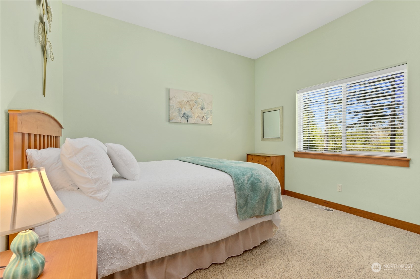 6605 Stringtown Road East Eatonville, WA 98328 - Photo 18 of 40 a bedroom with a bed and wooden floor