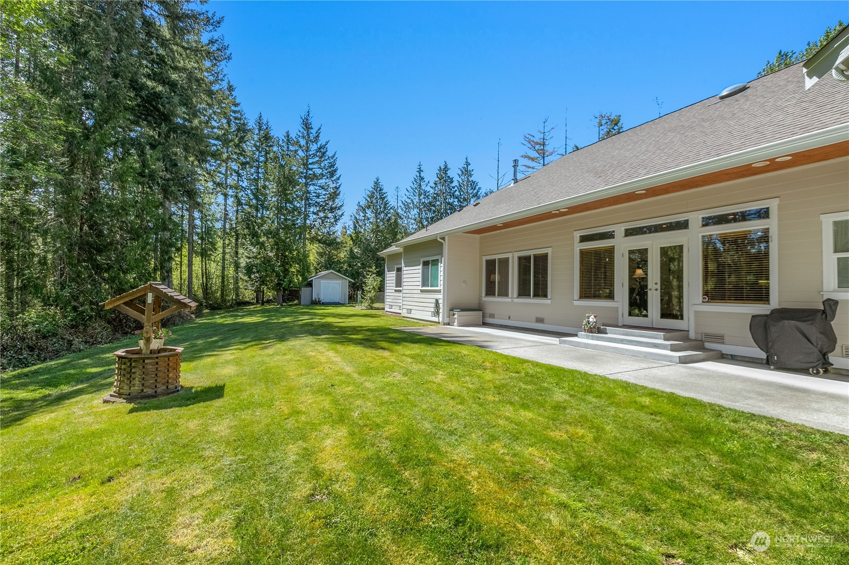 6605 Stringtown Road East Eatonville, WA 98328 - Photo 27 of 40 a view of a house with swimming pool and sitting area