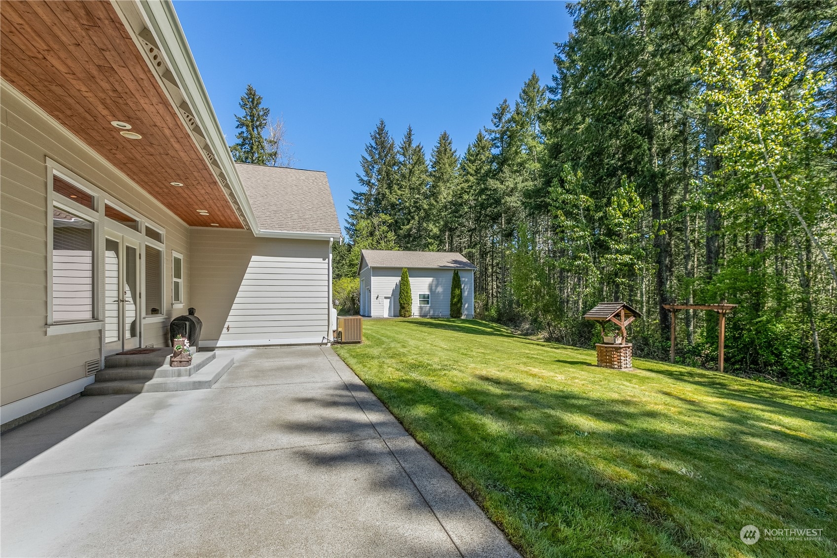 6605 Stringtown Road East Eatonville, WA 98328 - Photo 28 of 40 a front view of a house with a yard