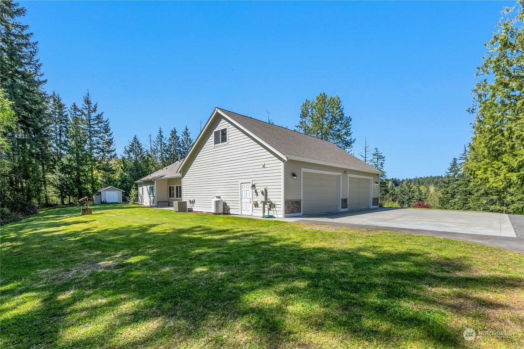 6605 Stringtown Road East Eatonville, WA 98328 - Photo 29 of 40 a house view with a garden space