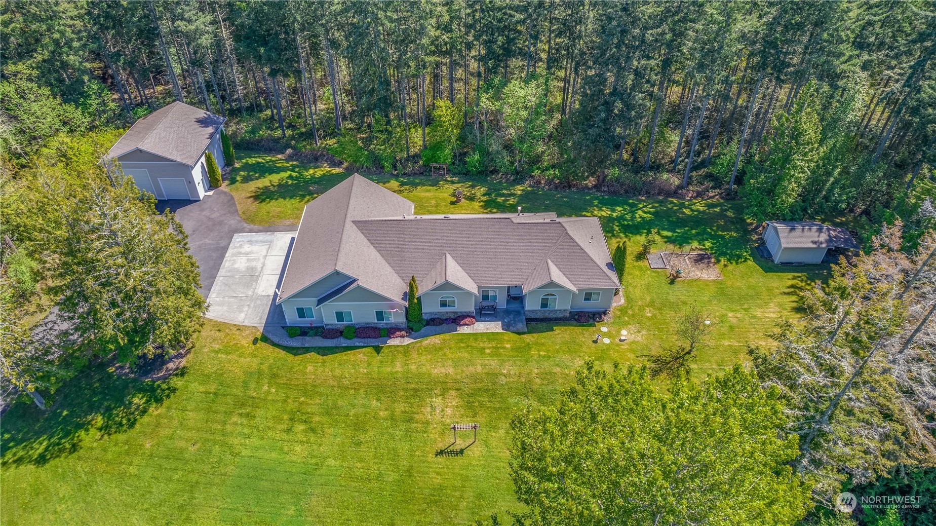 6605 Stringtown Road East Eatonville, WA 98328 - Photo 30 of 40 an aerial view of a house with swimming pool and garden