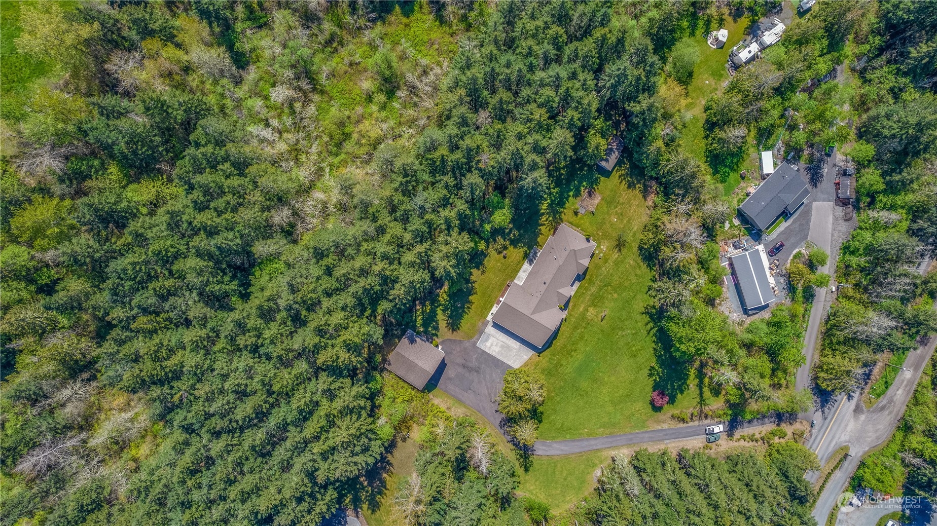 6605 Stringtown Road East Eatonville, WA 98328 - Photo 35 of 40 an aerial view of residential house with yard and swimming pool