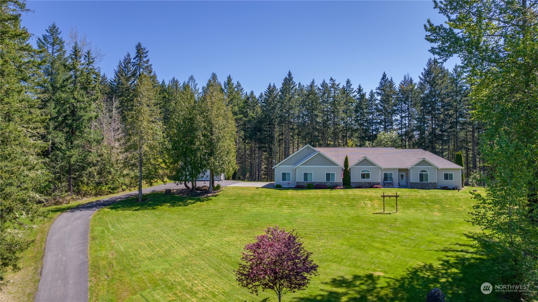 6605 Stringtown Road East Eatonville, WA 98328 - Photo 40 of 40 a view of a house with swimming pool and a yard