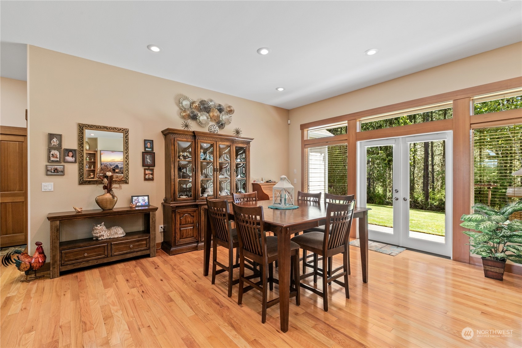 6605 Stringtown Road East Eatonville, WA 98328 - Photo 6 of 40 a view of a dining room with furniture window and wooden floor
