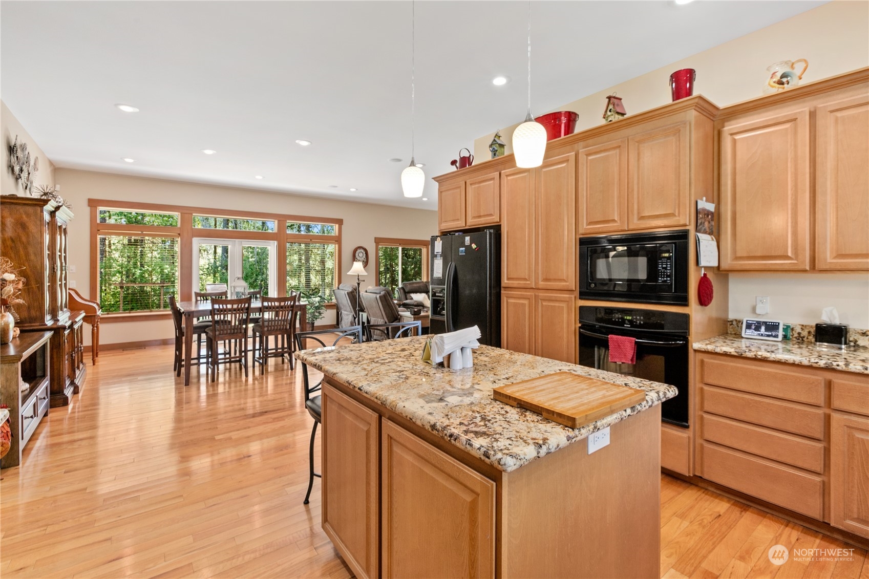 6605 Stringtown Road East Eatonville, WA 98328 - Photo 9 of 40 a kitchen with stainless steel appliances granite countertop a refrigerator and microwave