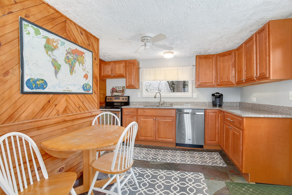 4 Acanthis Road Billerica, MA 01821 - Photo 5 of 12 a kitchen with granite countertop a refrigerator and a sink