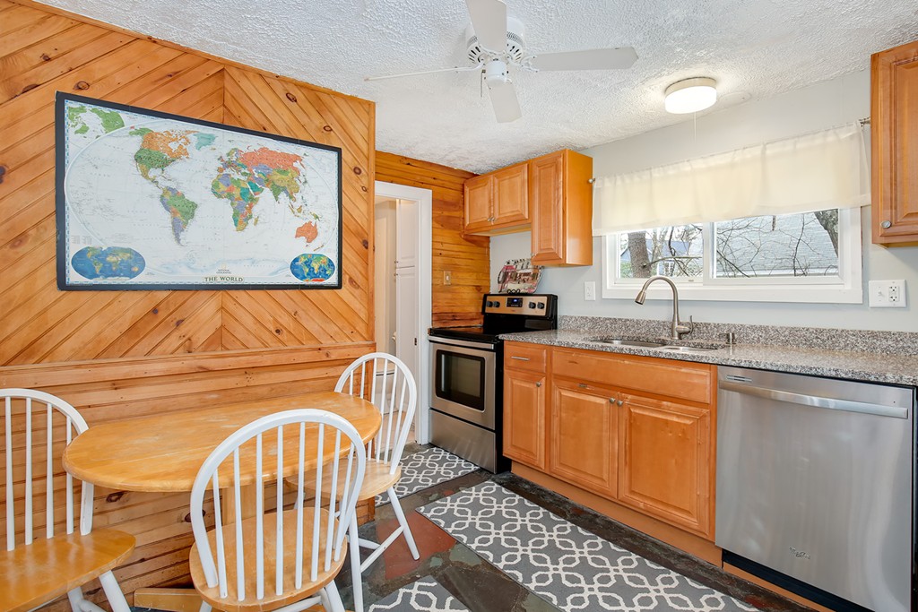 4 Acanthis Road Billerica, MA 01821 - Photo 6 of 12 a kitchen with stainless steel appliances granite countertop a stove a sink and a microwave