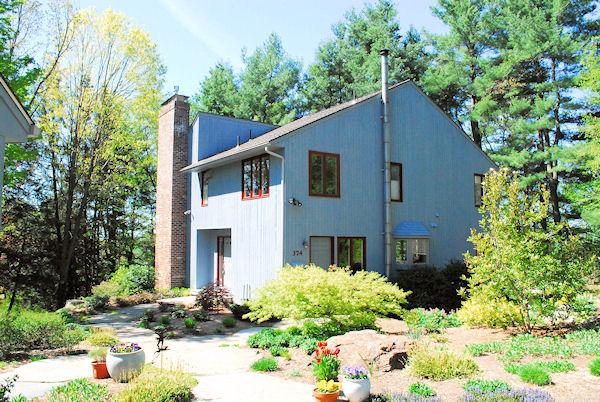 374 Old Montague Road Amherst, MA 01002 - Photo 1 of 30 a front view of a house with a yard