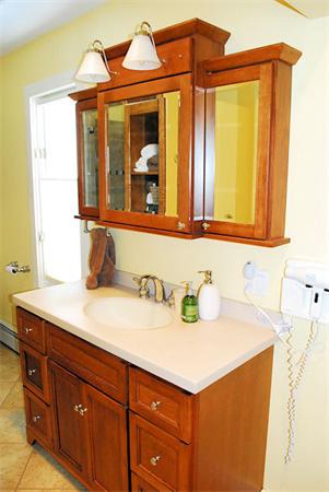 374 Old Montague Road Amherst, MA 01002 - Photo 14 of 30 a bathroom with a sink and a mirror