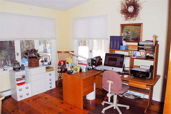374 Old Montague Road Amherst, MA 01002 - Photo 17 of 30 a room with furniture and a workspace