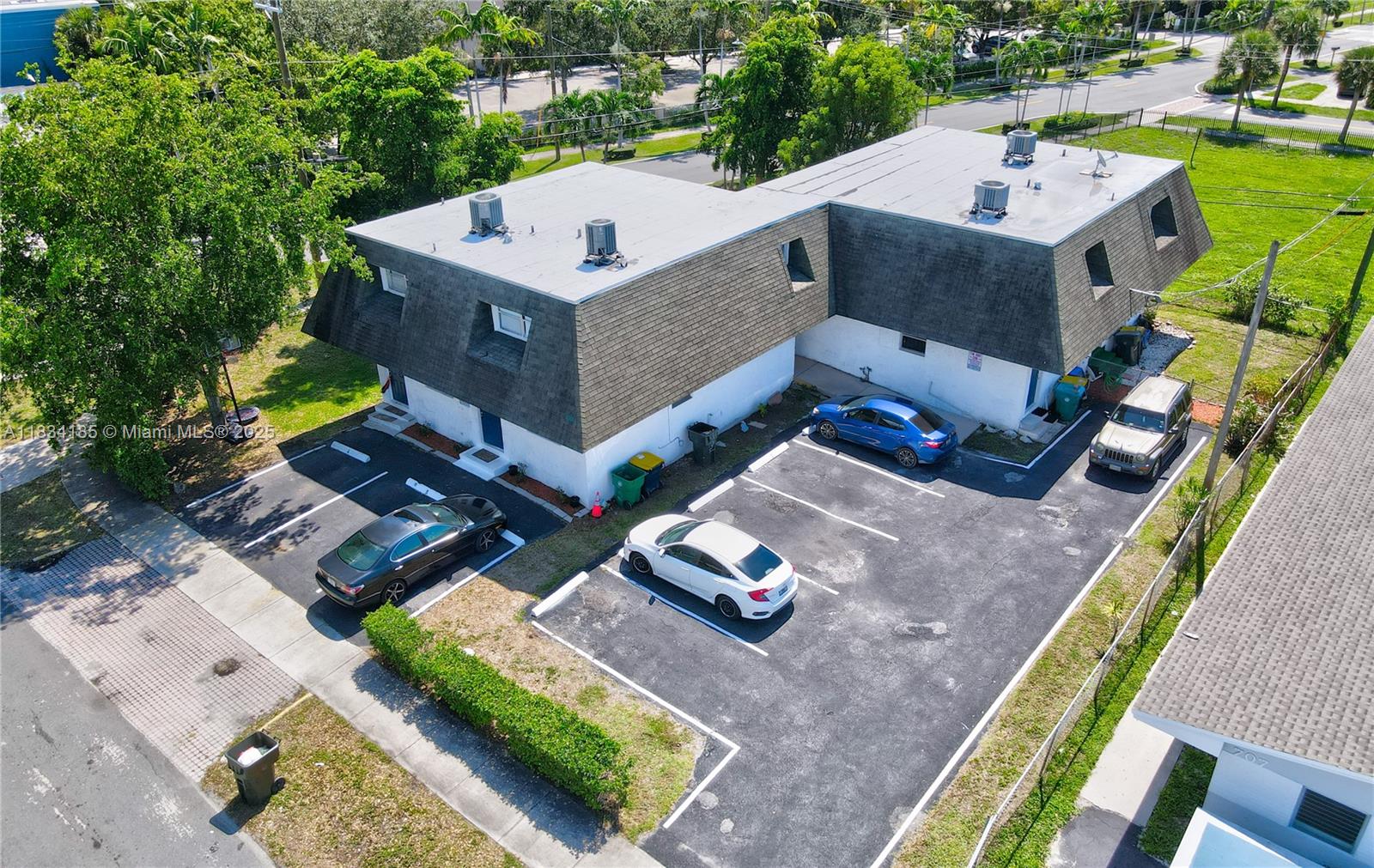 502-504 Phippen Waiters Road, Unit 3 Dania Beach, FL 33004 - Photo 1 of 17 an aerial view of a house with a garden