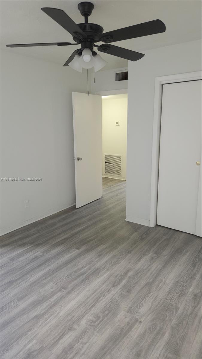 502-504 Phippen Waiters Road, Unit 3 Dania Beach, FL 33004 - Photo 13 of 17 a view of a room with wooden floor