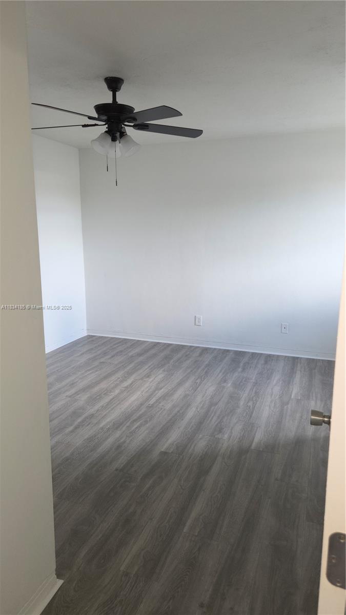 502-504 Phippen Waiters Road, Unit 3 Dania Beach, FL 33004 - Photo 14 of 17 a view of a room with wooden floor