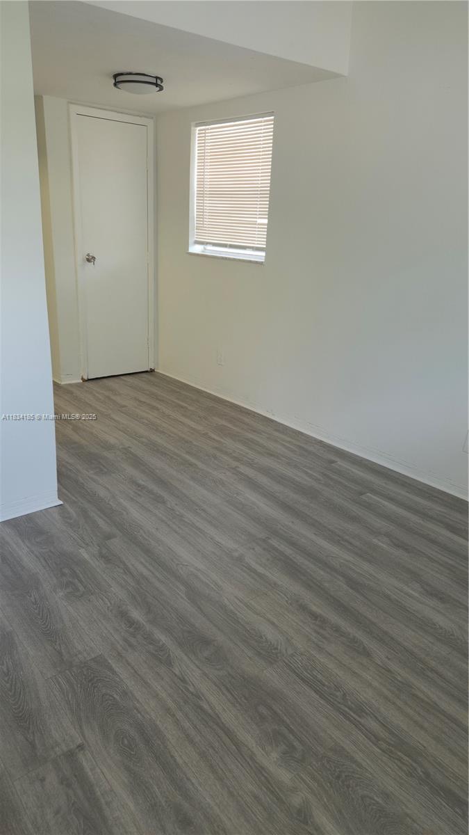 502-504 Phippen Waiters Road, Unit 3 Dania Beach, FL 33004 - Photo 2 of 17 wooden floor in an empty room