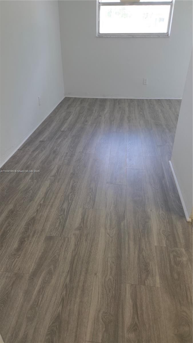 502-504 Phippen Waiters Road, Unit 3 Dania Beach, FL 33004 - Photo 5 of 17 a view of a room with wooden floor