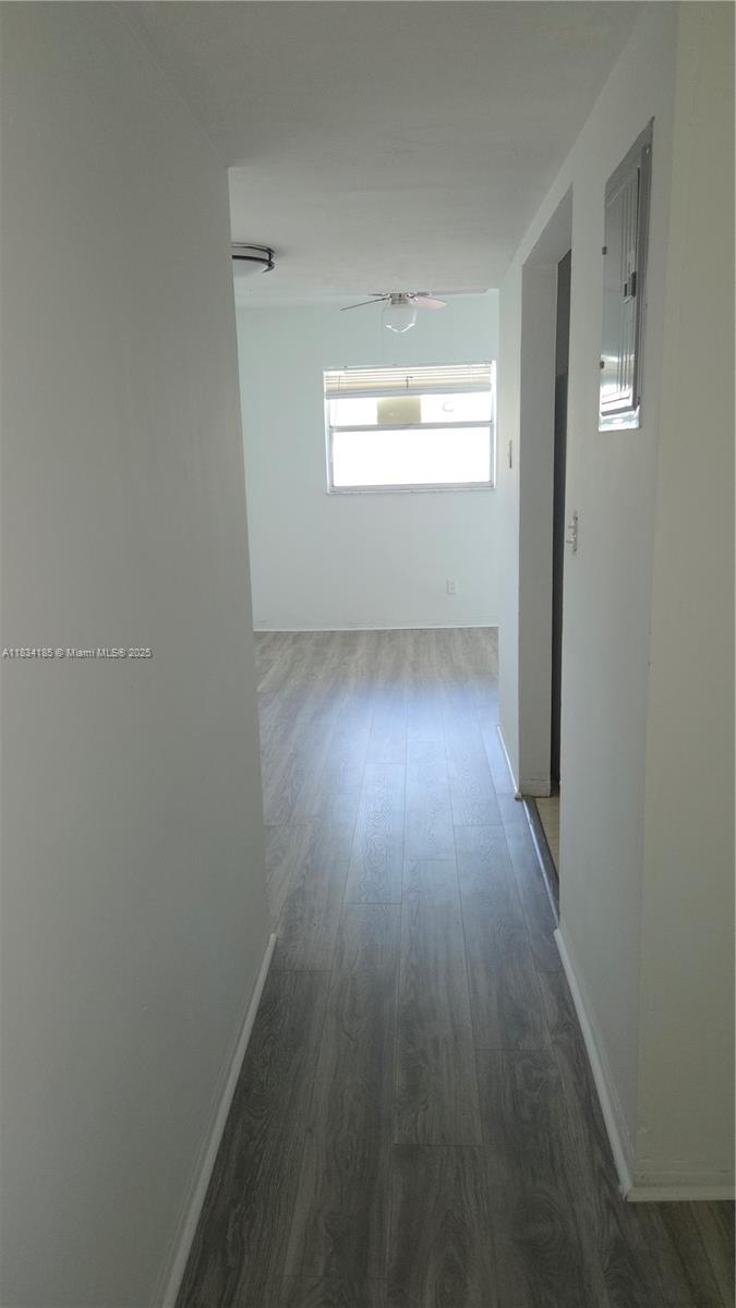 502-504 Phippen Waiters Road, Unit 3 Dania Beach, FL 33004 - Photo 10 of 17 a view of wooden floor and windows in a room