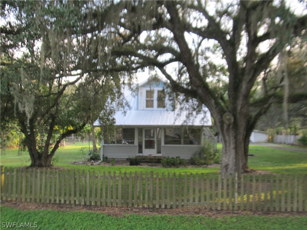 15850 Old Olga Road Alva, FL 33920 - Photo 1 of 11 a front view of a house with a yard