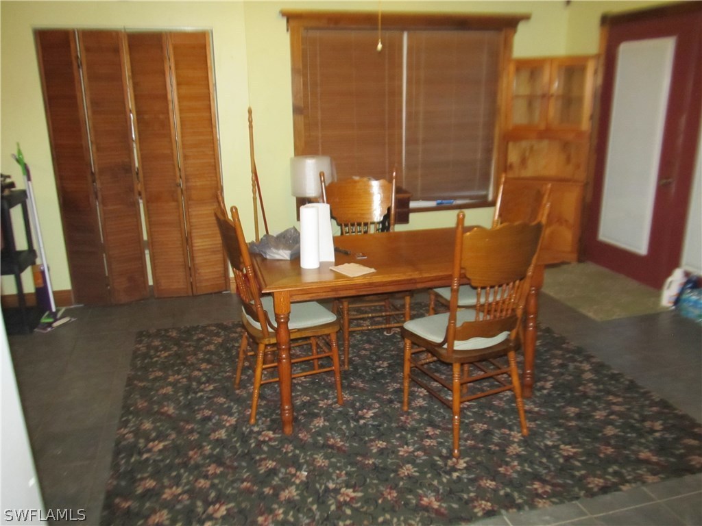 15850 Old Olga Road Alva, FL 33920 - Photo 6 of 11 a dining room with furniture and wooden floor