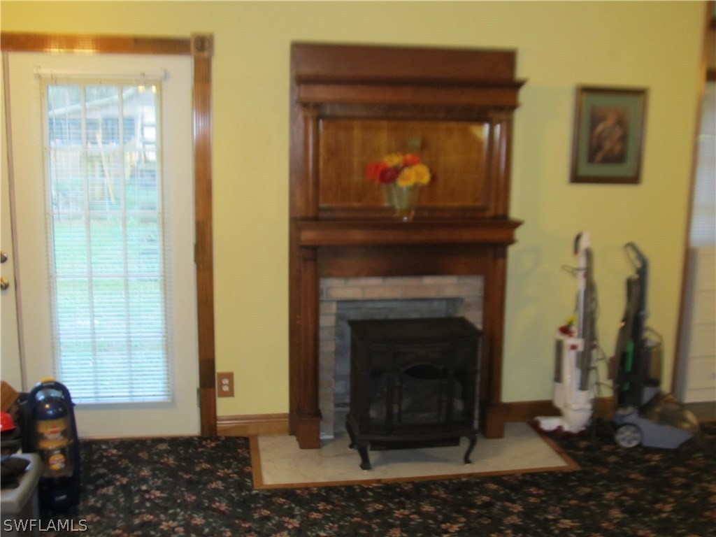 15850 Old Olga Road Alva, FL 33920 - Photo 7 of 11 a living room with a fireplace