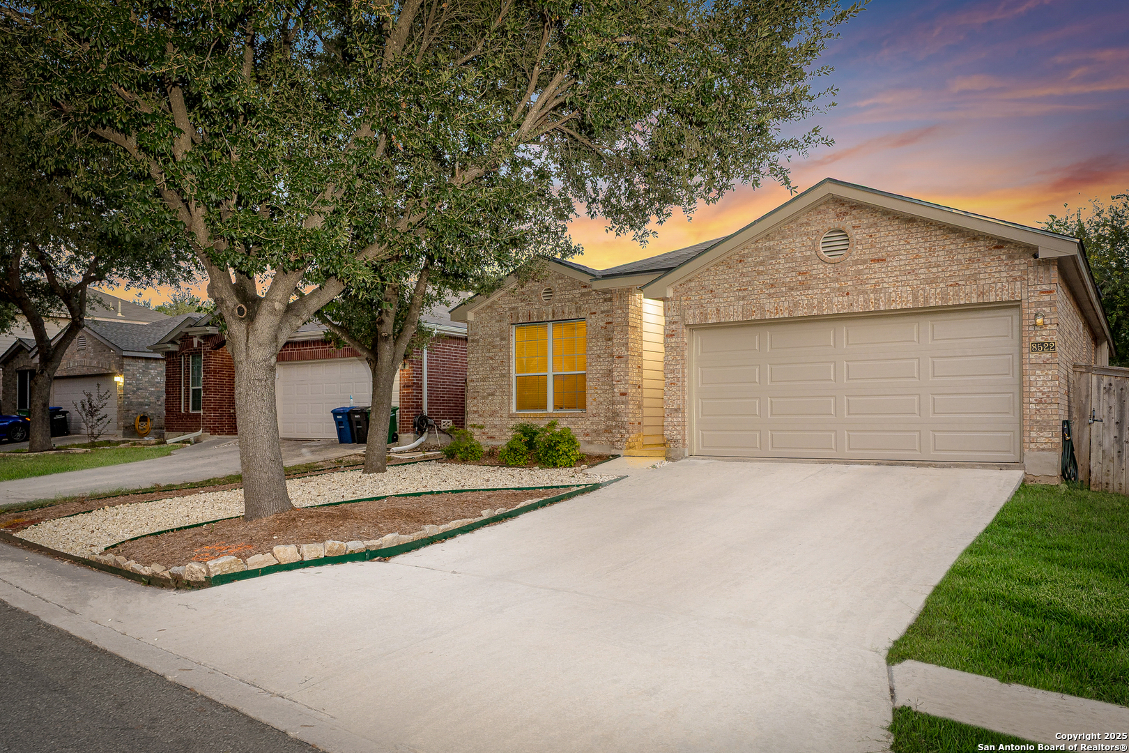 8522 Sonora Pass Helotes, TX 78023 - Photo 1 of 27 a front view of a house with yard garage and outdoor seating