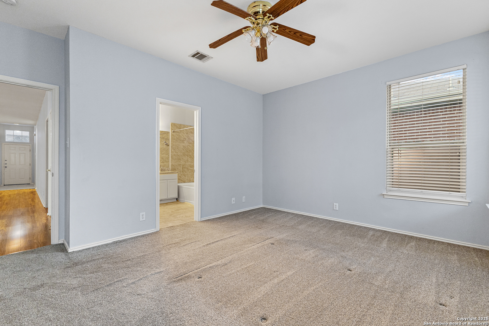 8522 Sonora Pass Helotes, TX 78023 - Photo 20 of 27 wooden floor in an empty room with a window