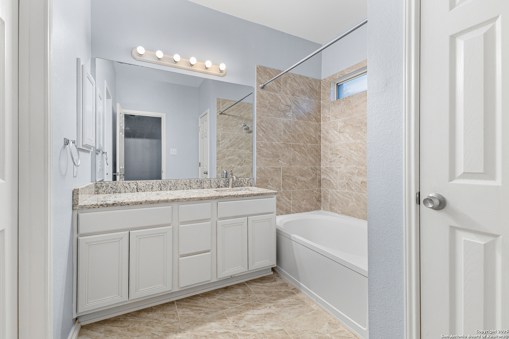 8522 Sonora Pass Helotes, TX 78023 - Photo 22 of 27 a bathroom with a tub sink shower and mirror