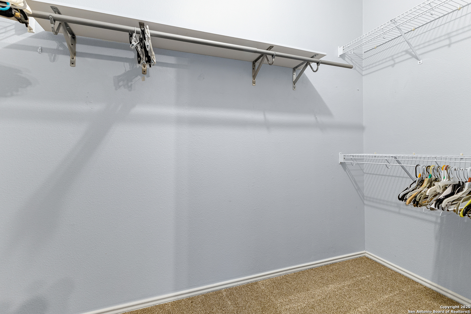 8522 Sonora Pass Helotes, TX 78023 - Photo 24 of 27 a view of a room with racks on the wall