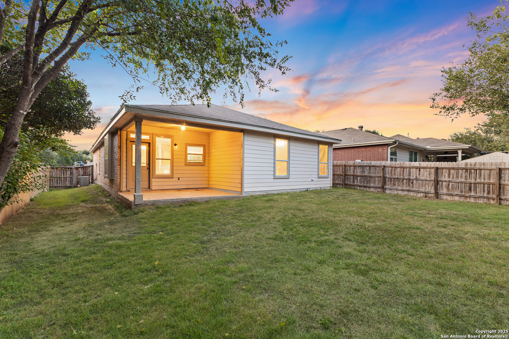 8522 Sonora Pass Helotes, TX 78023 - Photo 25 of 27 a view of a backyard with a garden and deck
