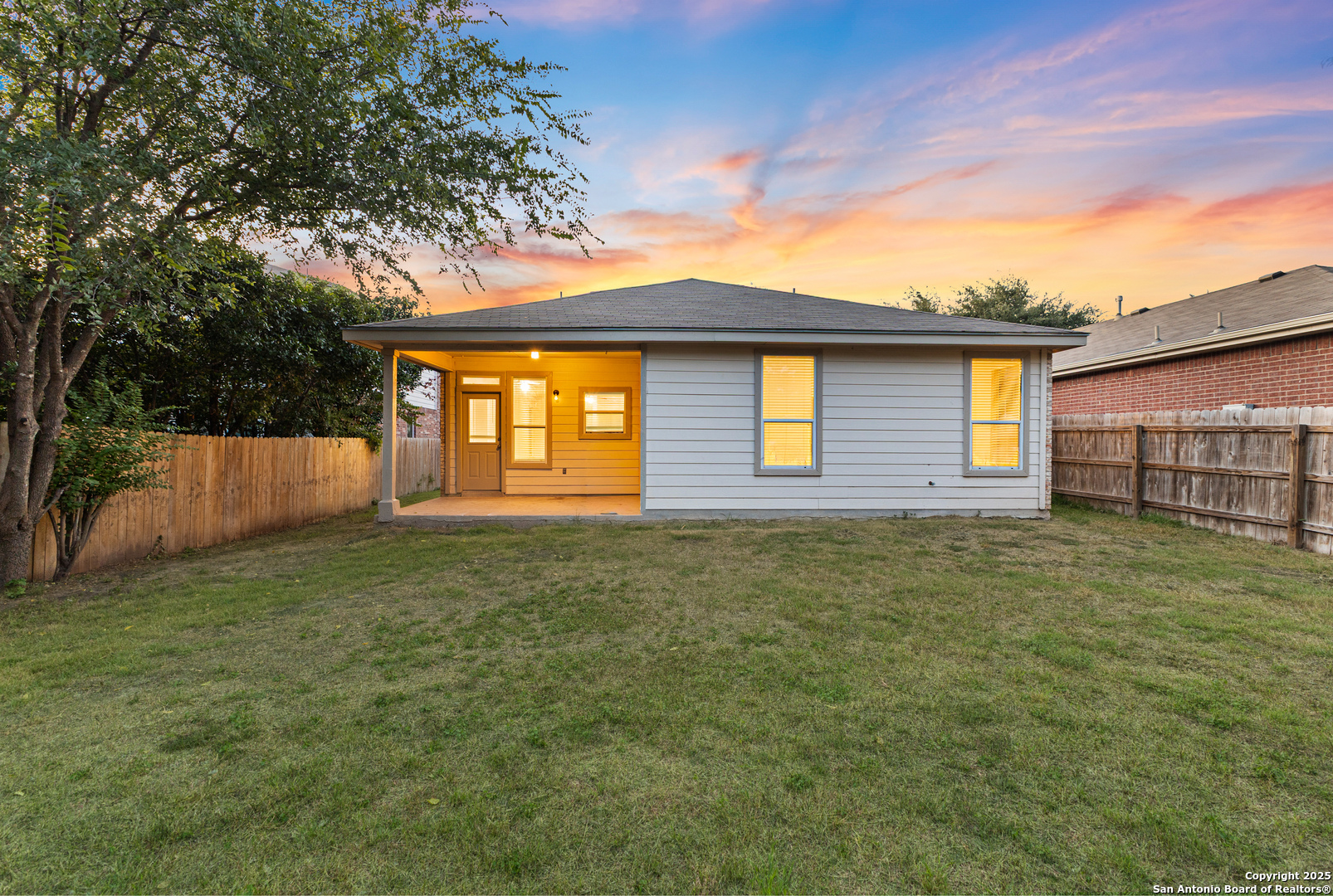 8522 Sonora Pass Helotes, TX 78023 - Photo 26 of 27 a front view of a house with a yard