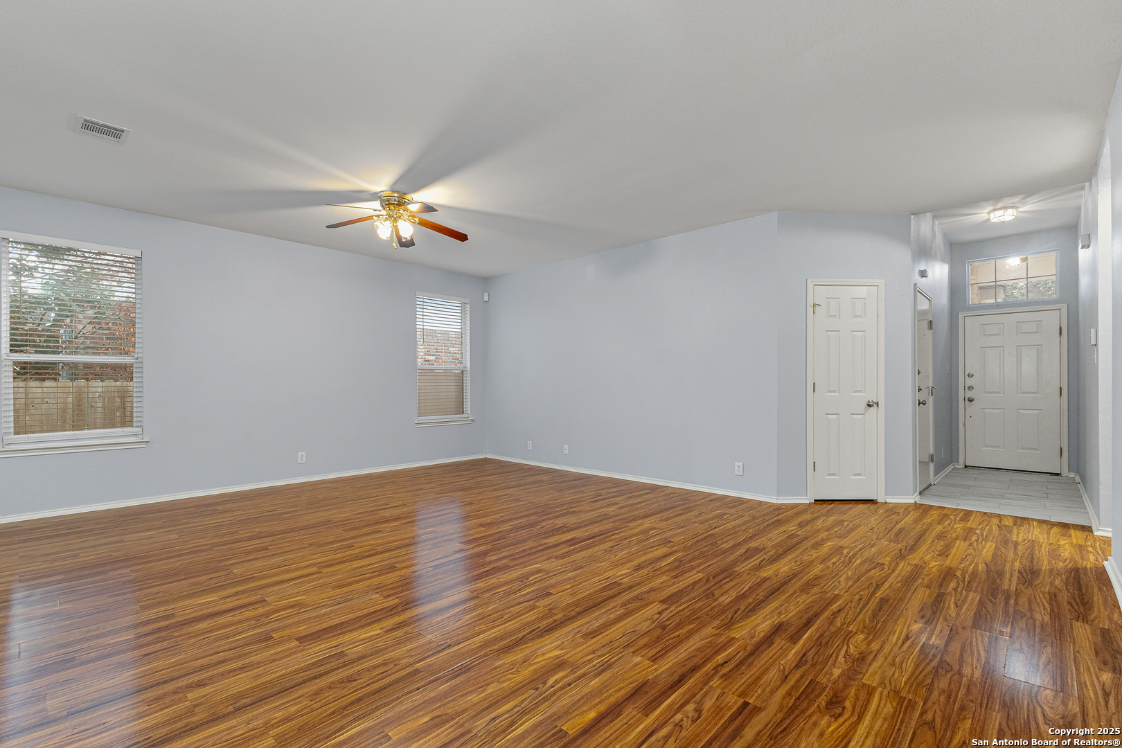 8522 Sonora Pass Helotes, TX 78023 - Photo 8 of 27 a view of empty room with wooden floor and fan
