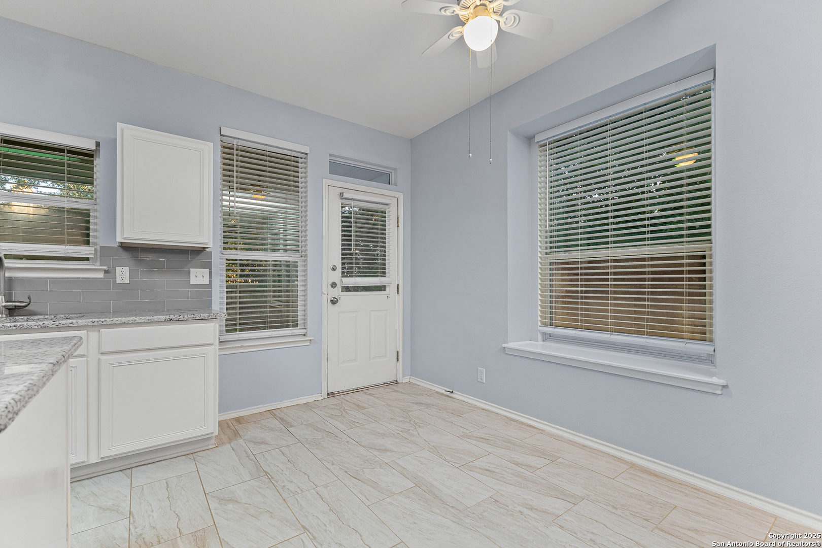 8522 Sonora Pass Helotes, TX 78023 - Photo 10 of 27 a view of an empty room with a sink and a window
