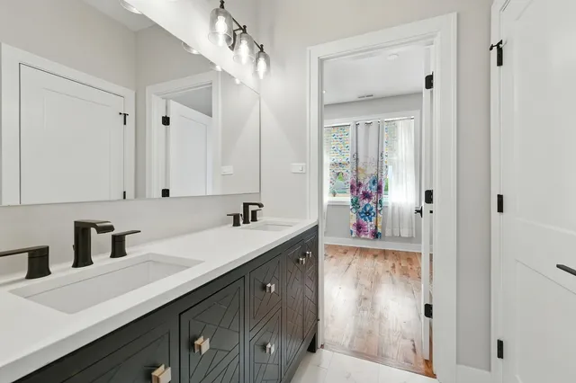 a bathroom with a bath tub with a shower