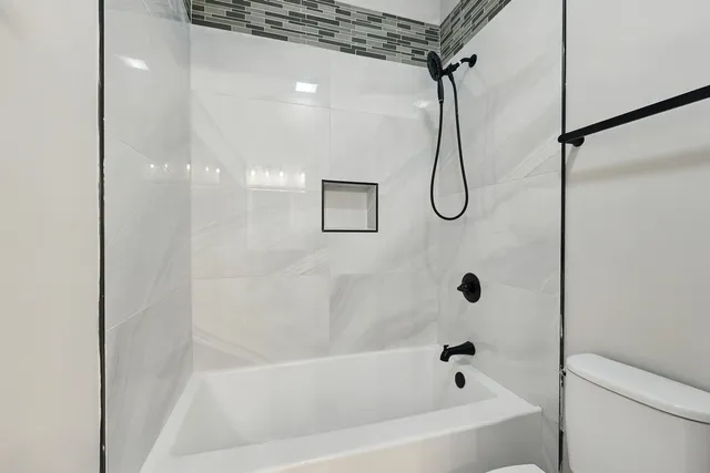 a view of an empty room with kitchen appliances