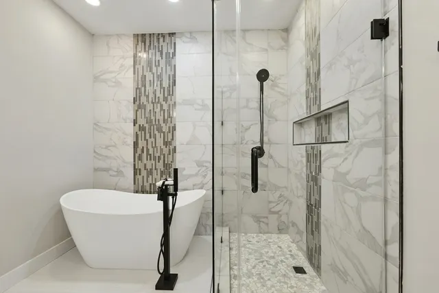 a bathroom with a double vanity sink toilet and shower