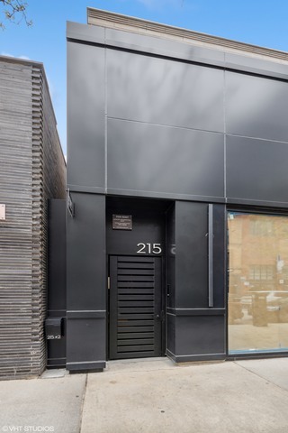 a bathroom with a shower and a wooden door