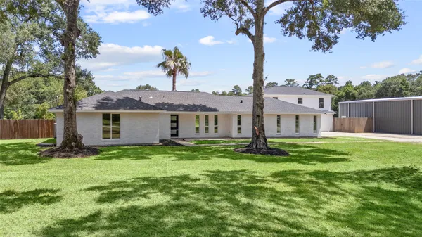 an aerial view of a house with outdoor space