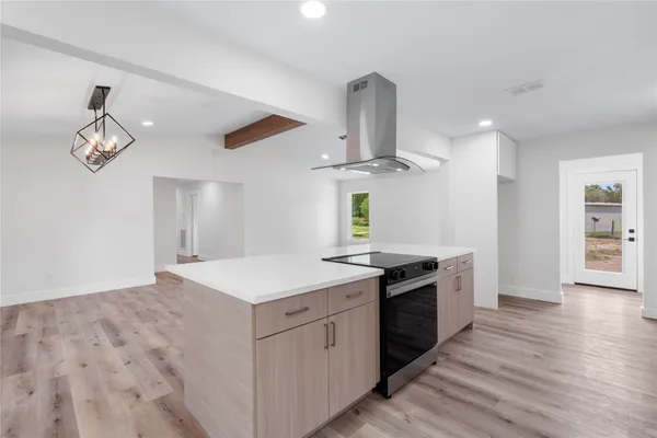 an aerial view of a house with outdoor space